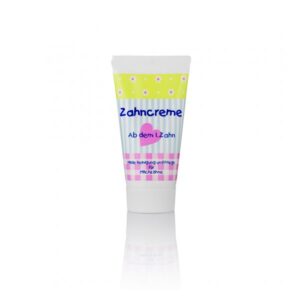 Zahncreme in einer Tube mit buntem Design, geeignet für die Pflege von Milchzähnen.